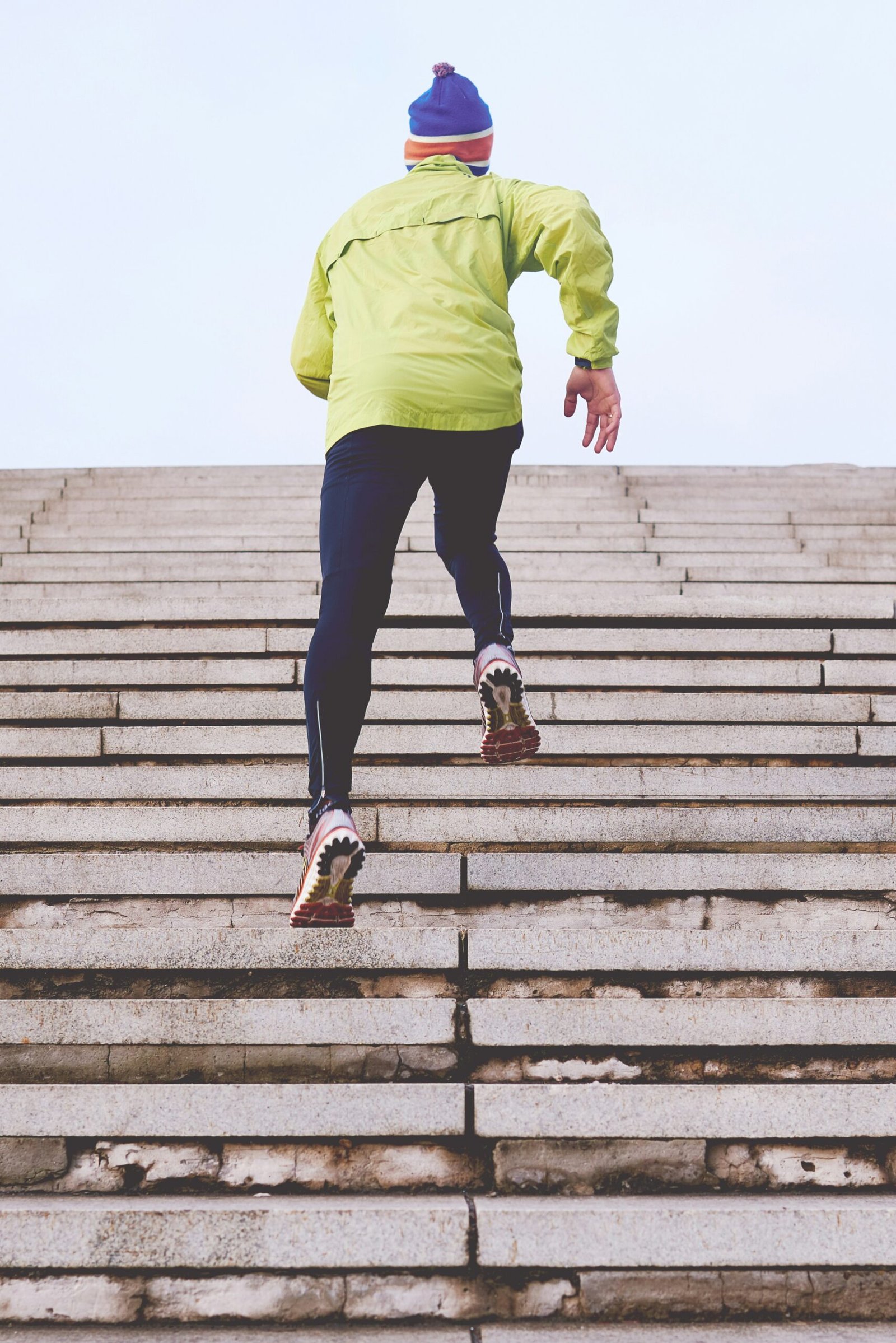 person climbing concrete stairs